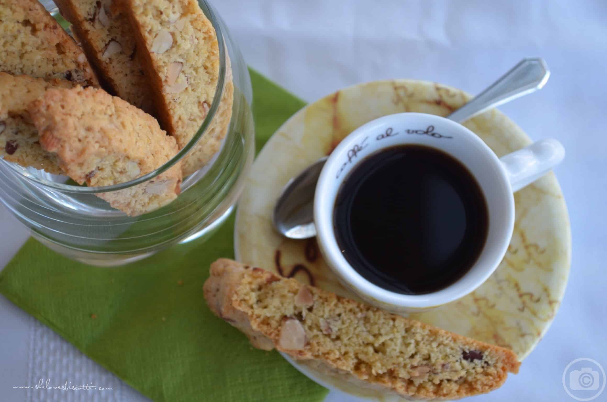 An overhead view of an espresso cup and almond biscotti.