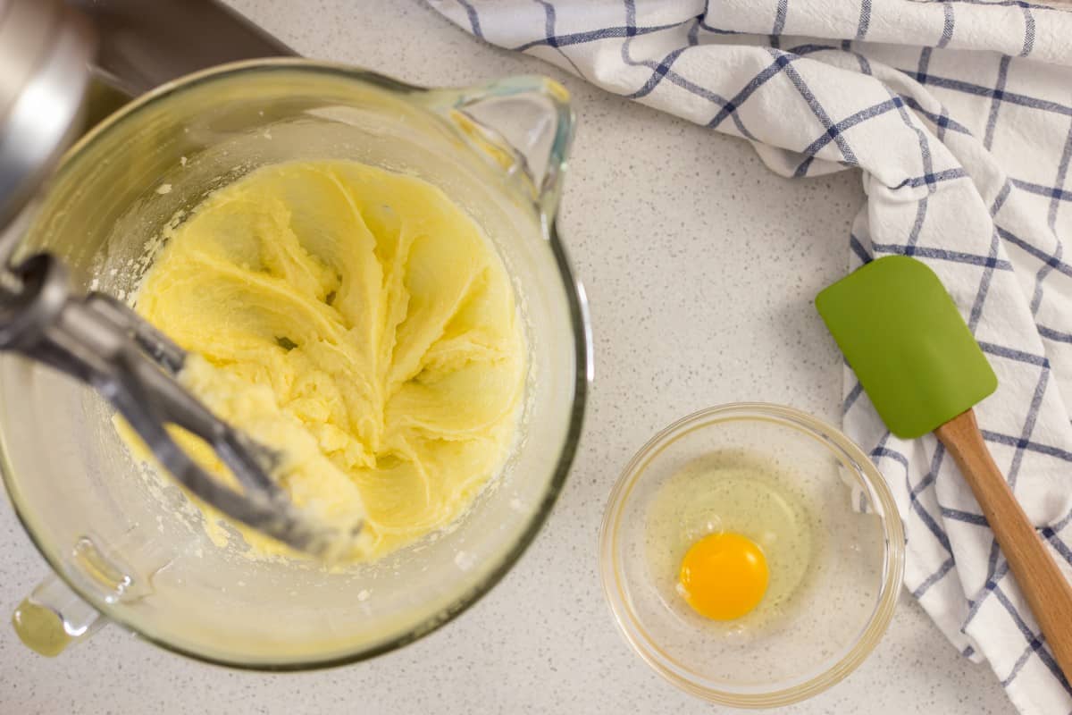 The creamy yellow texture of eggs, butter and sugar is an important step to make chocolate biscotti.