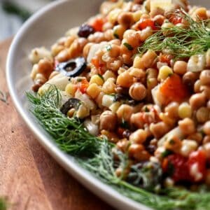 A serving bowl filled with fregola salad.