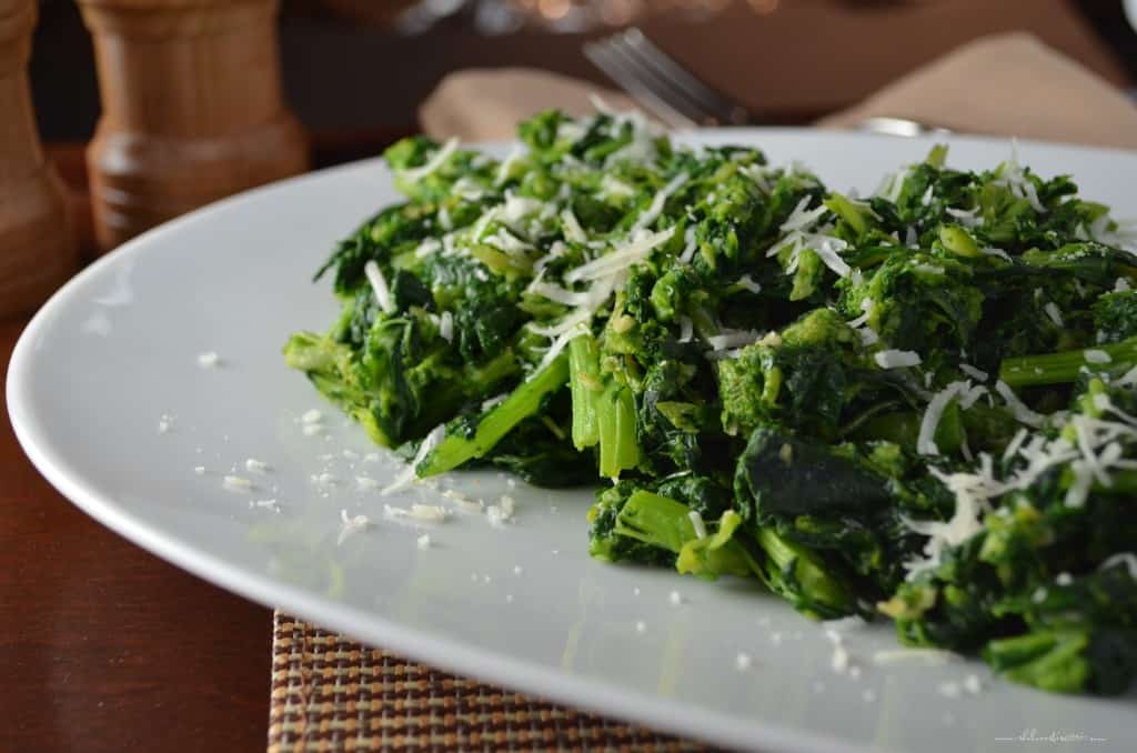 Italian-Style Garlicky Broccoli Rabe served on a large white platter.