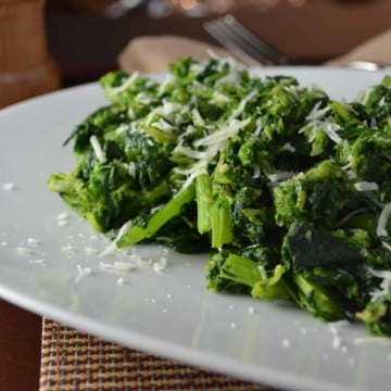 Italian-Style Garlicky Broccoli Rabe served on a large white platter.