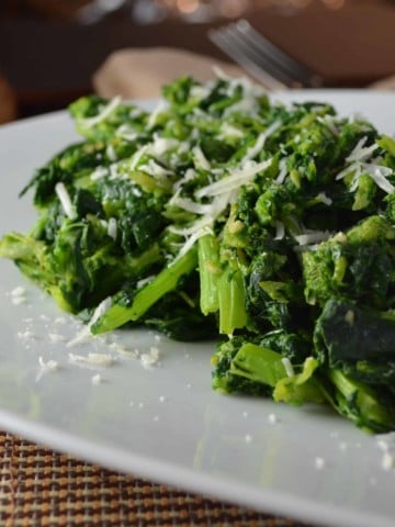 Italian-Style Garlicky Broccoli Rabe served on a large white platter.