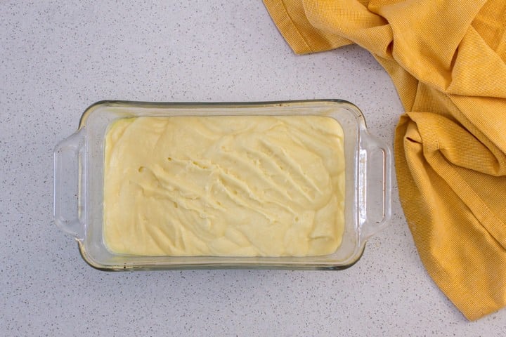 The batter for the lemon bread is in the pan ready to be baked.