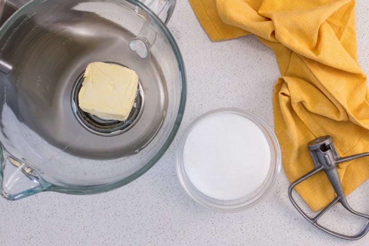 The butter required to make this lemon loaf recipe is in the bowl of a stand mixture.