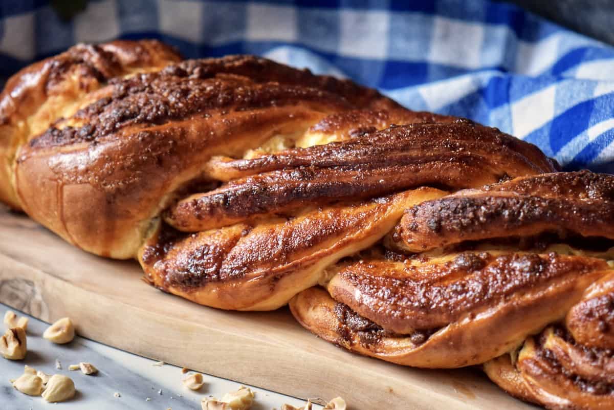 Braided sweet dough on cutting board. 