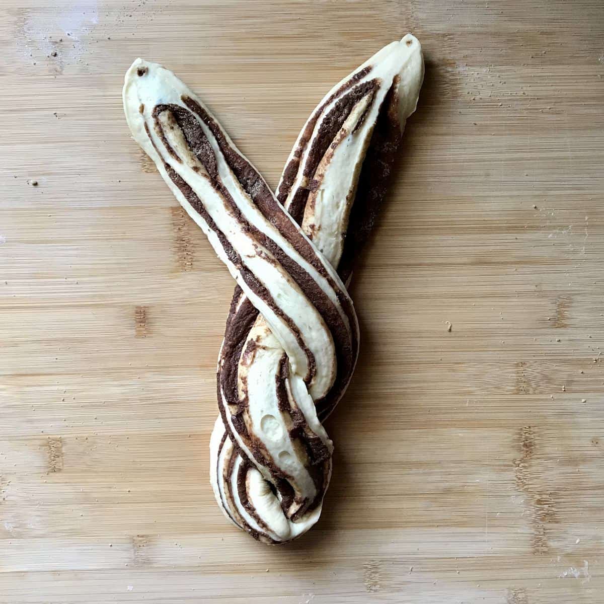 A sweet bread is half braided. 