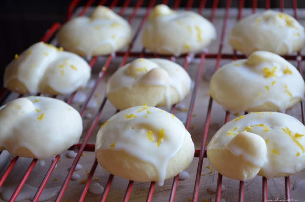 Glazed lemon cookies on a rack.
