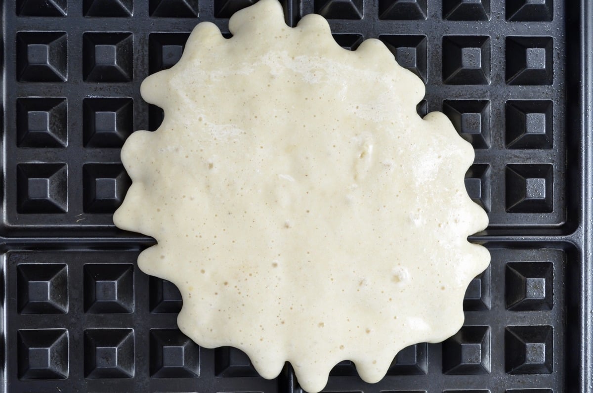 Waffle batter on the waffle iron.