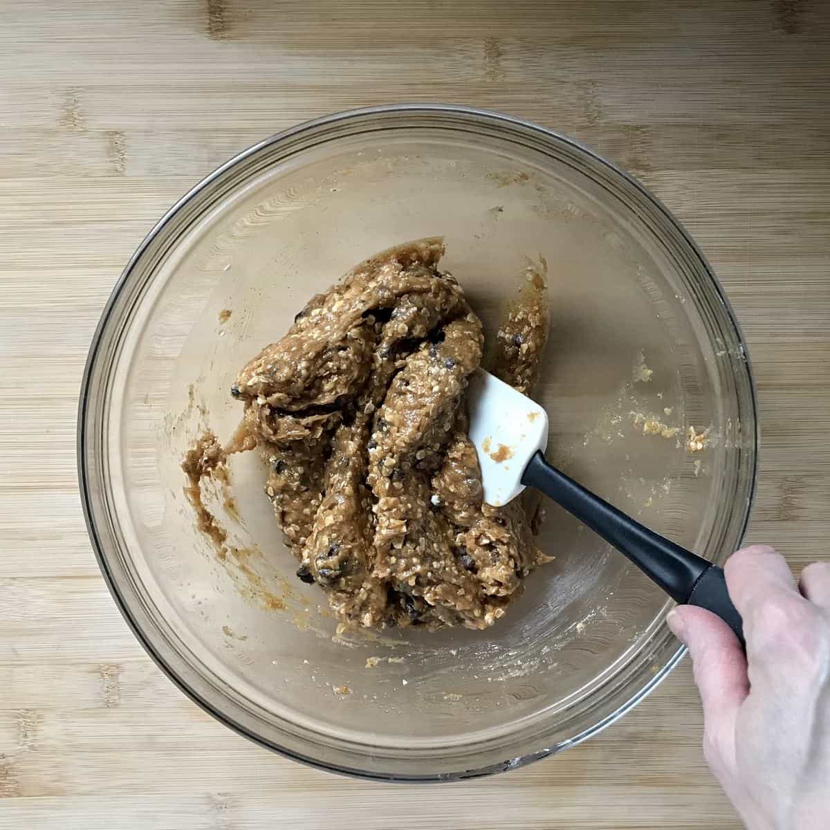 Almond butter cookie dough combined in a bowl.