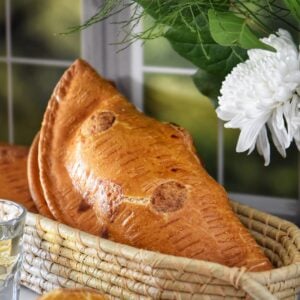 Italian savory cheese pies in a wicker basket.