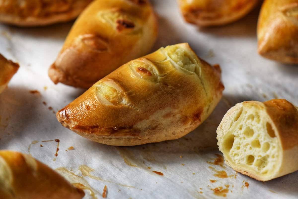 Italian sweet ricotta Easter pies on a parchment lined baking sheet.