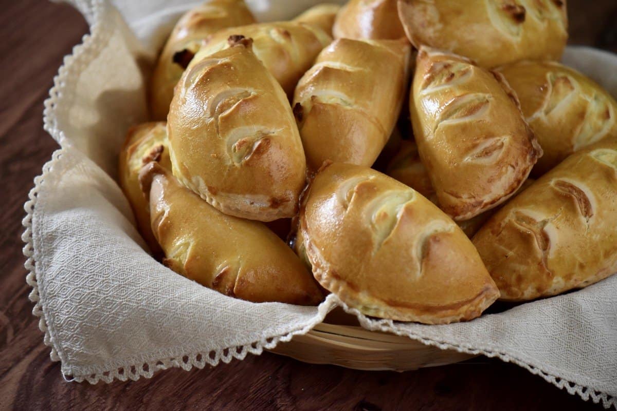 Sweet Italian ricotta pies in a wicker basket.