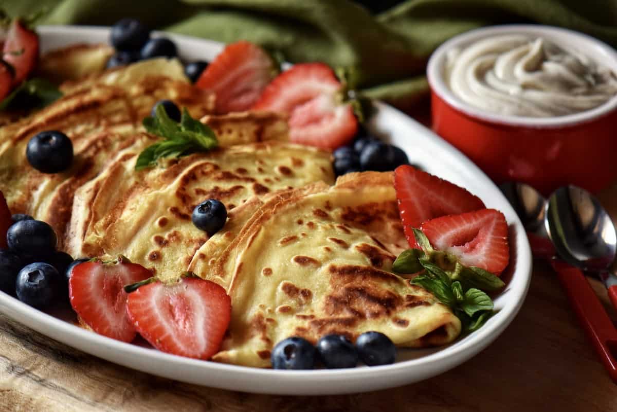 Sweet crepes with fresh fruit and ricotta.