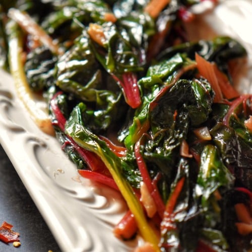 Sauteed Rainbow chard in a white plate.