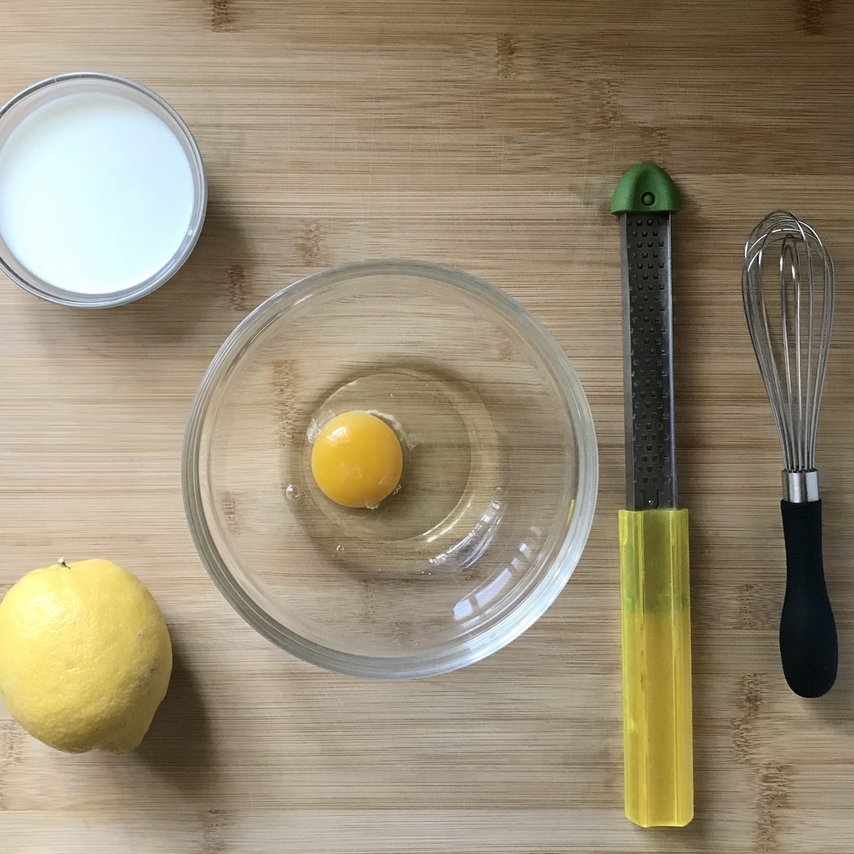 The wet ingredients to make the scones are in bowls.