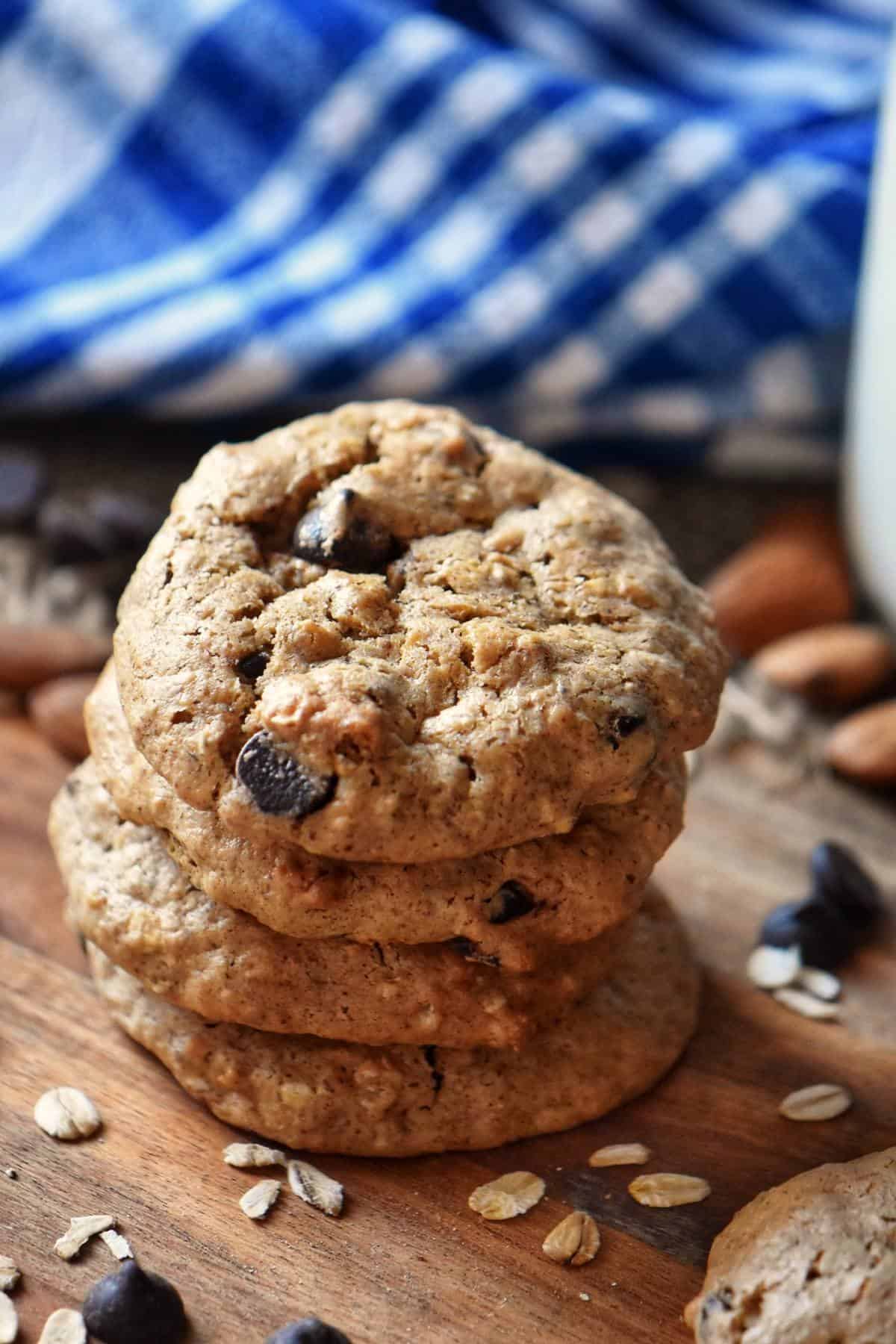 A stack of Almond Butter Cookies on a wooden board.