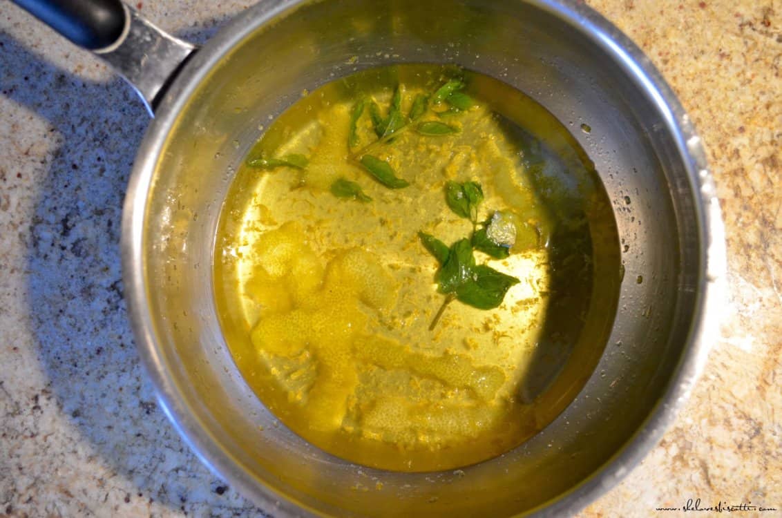 Adding the lemon zest and mint to make the lemon ice.