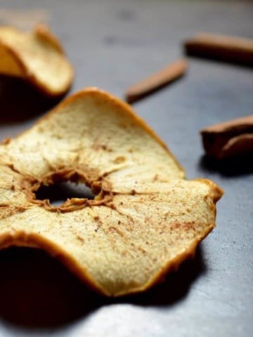 A single Homemade Oven Baked Apple Chip