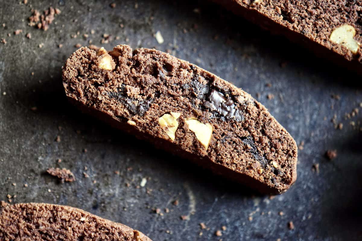 An overhead close up photo of a chocolate hazelnut biscotti.