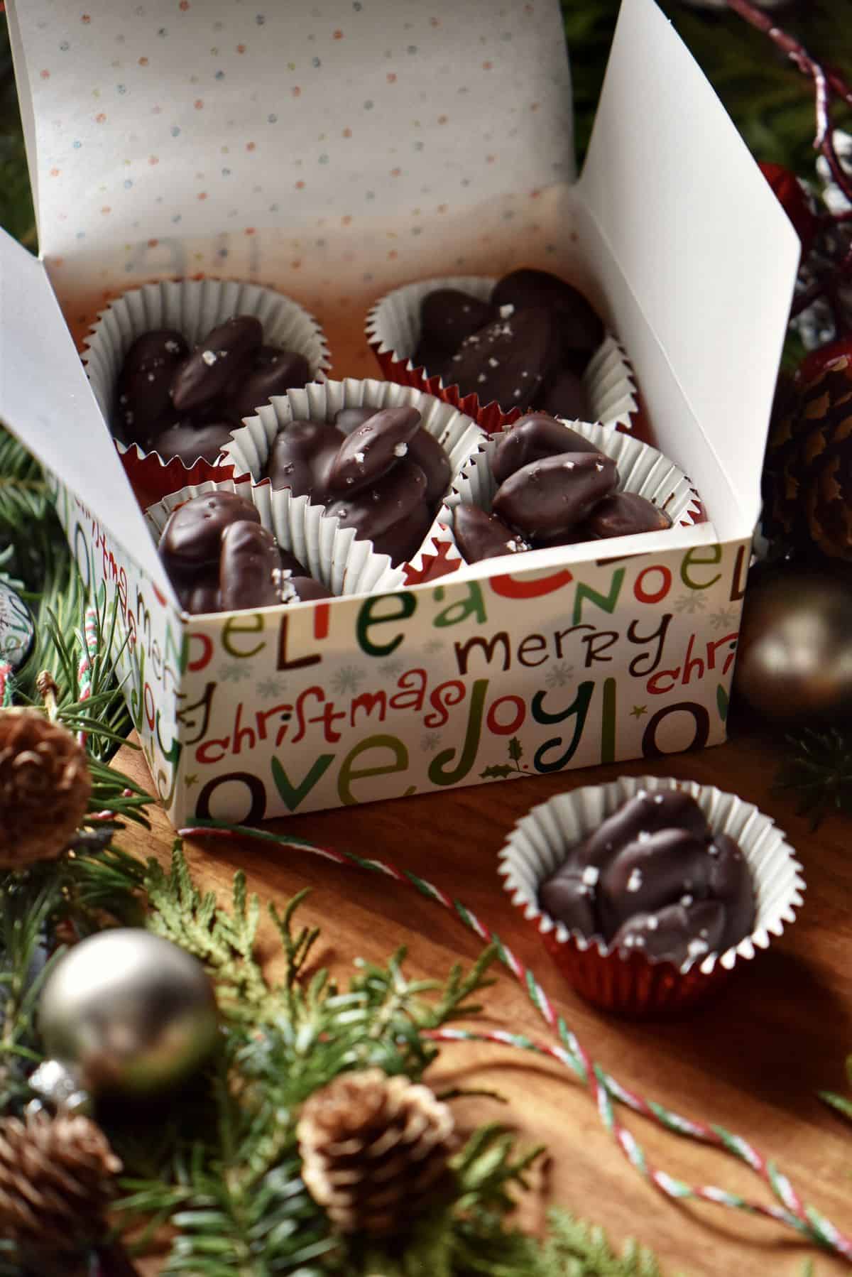Chocolate covered almonds in a decorative box.