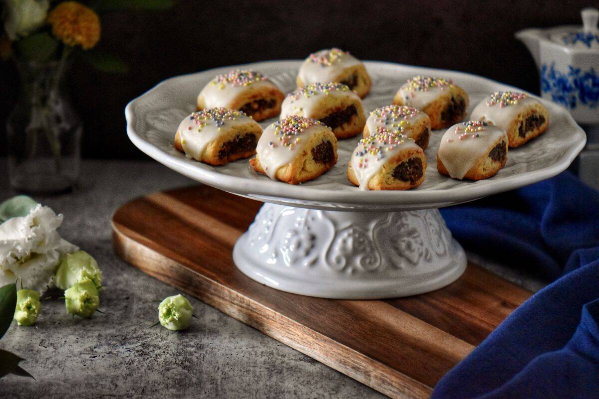 Cuccidati on a white cake platter.