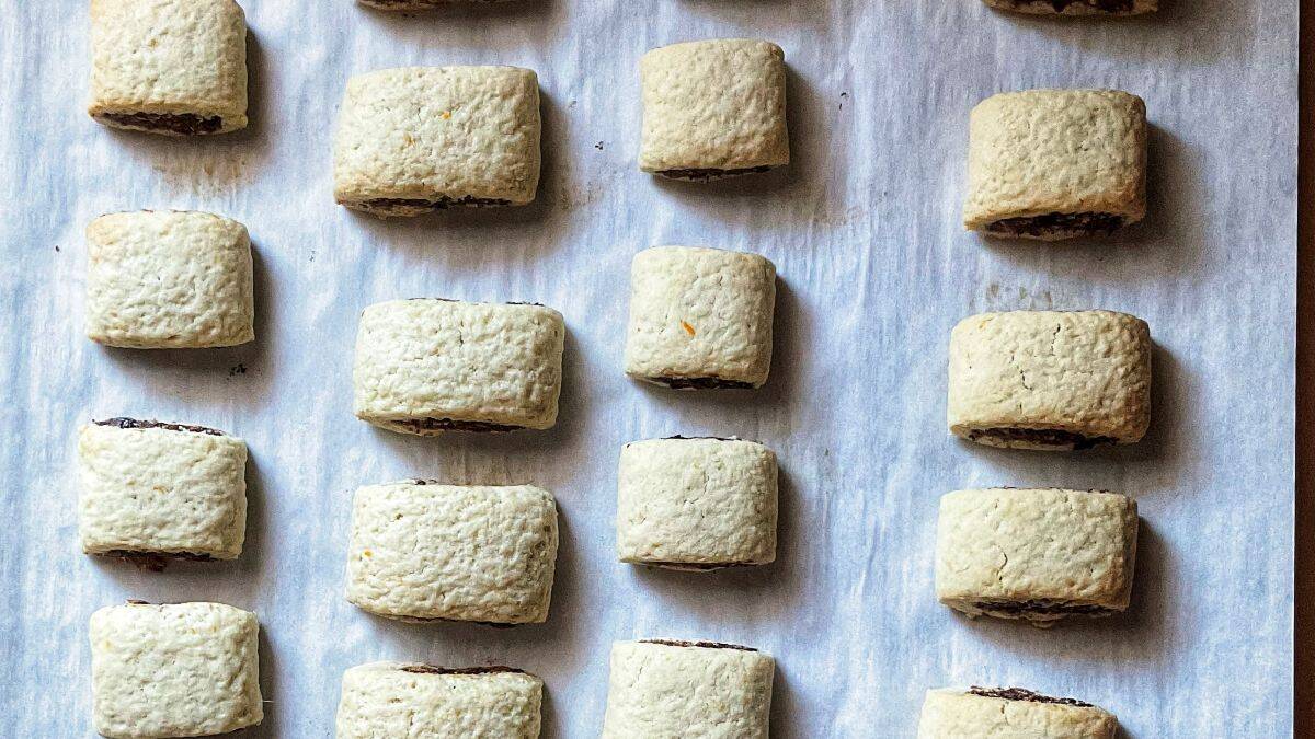 Baked Italian fig cookies on parchment paper. 