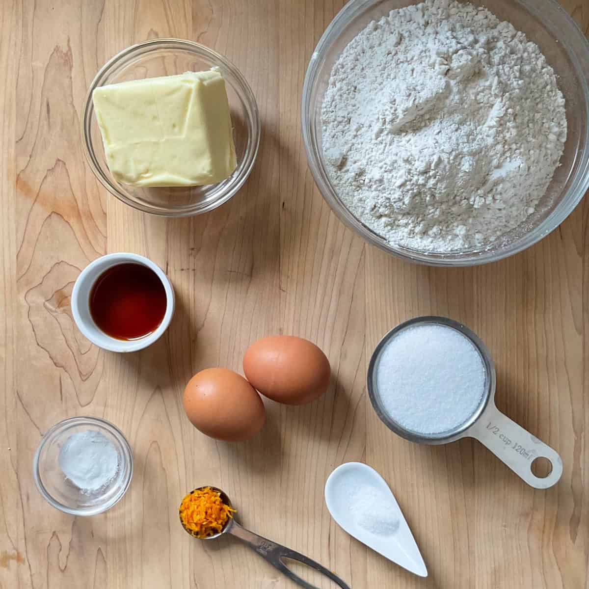 Ingredients to make fig cookie dough on a wooden surface. 