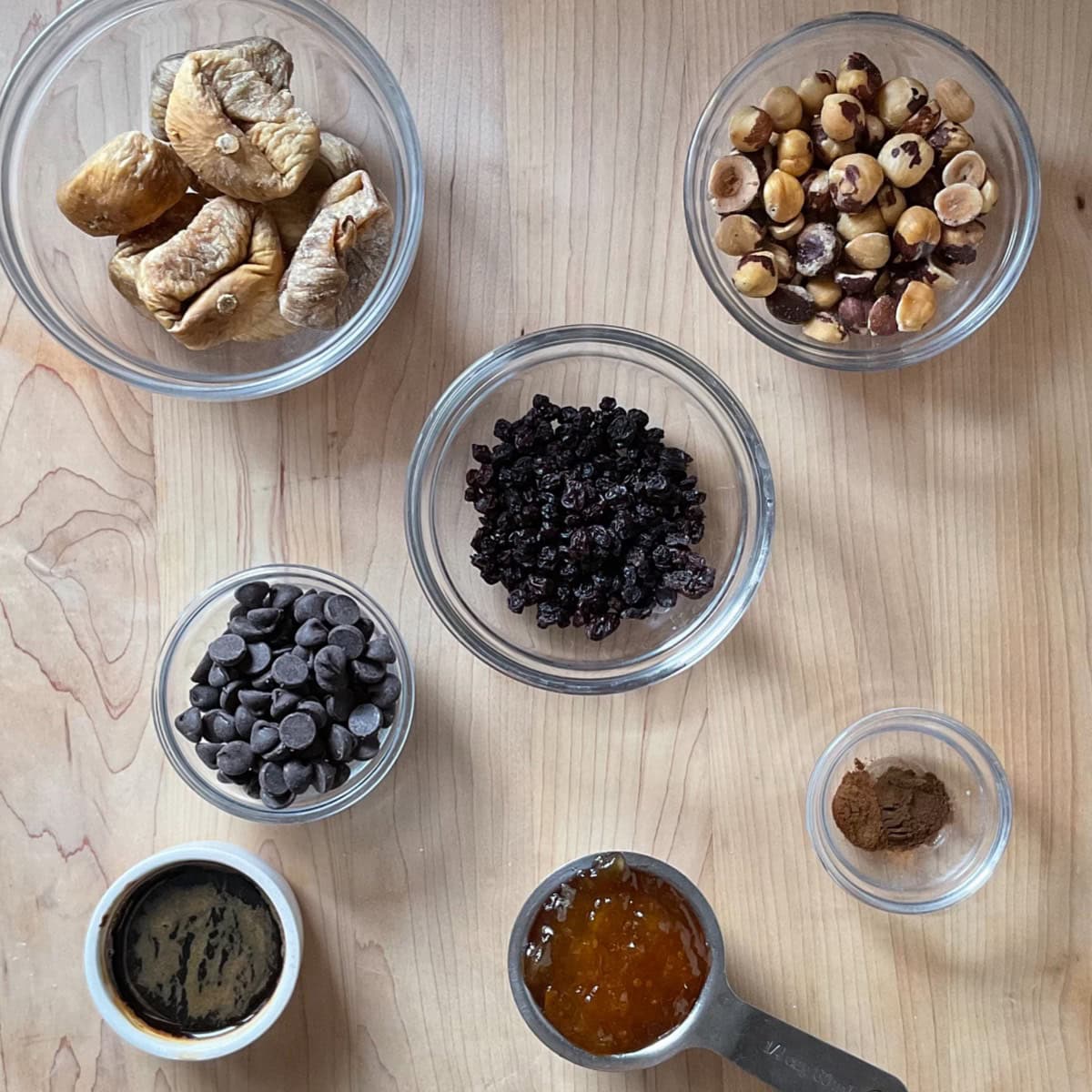 Ingredients to make fig cookie filling on a wooden surface. 