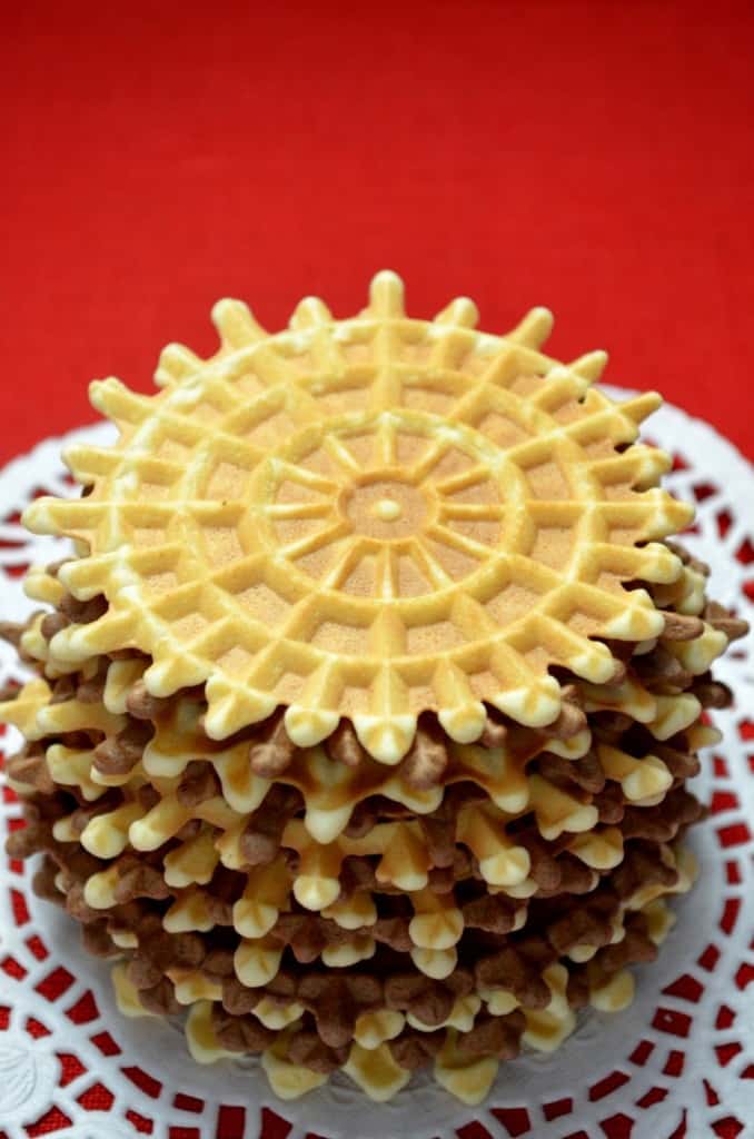 A stack of vanilla and chocolate pizzelle.