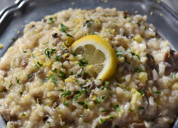 A closeup shot of the risotto indicates the creamy texture of this Italian comfort food.