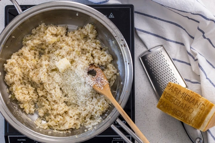 Grated cheese and butter a top the mushroom risotto.