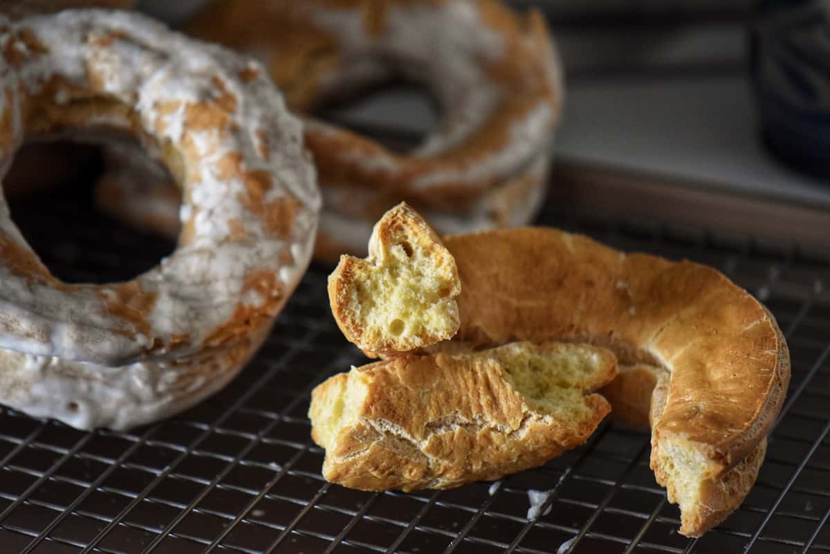 An unglazed taralli is cut in half.