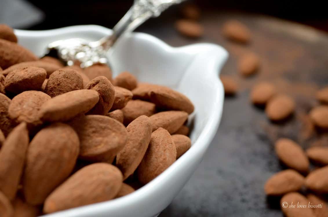 A close up picture of cocoa dusted almonds.