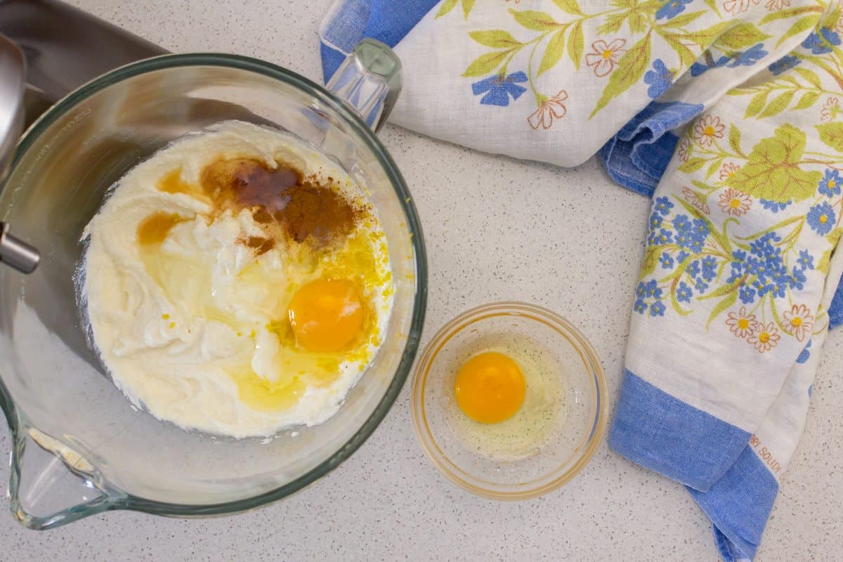 The ingredients required to make the filling for the ricotta pie are in a food processor.