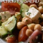 A white bowl with a generous portion of chickpea salad.