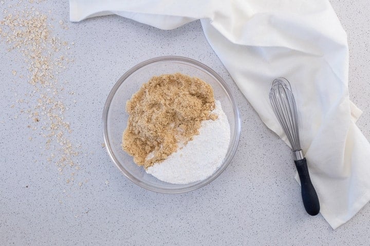 The oat crumble mixture for the date filling in a large bowl.