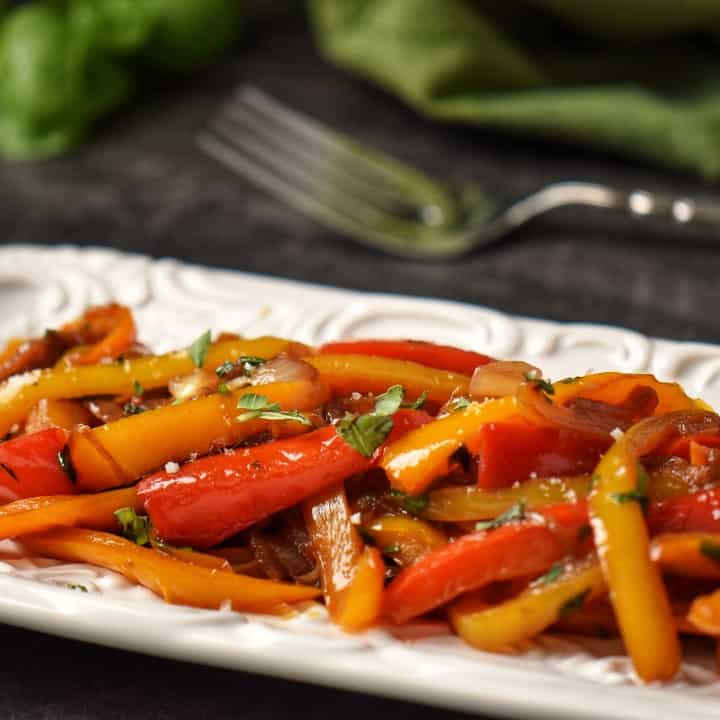 Peperonata in a white serving dish.