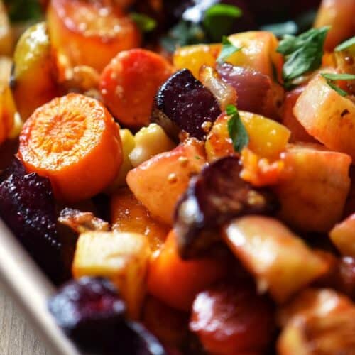 Beets and turnips, along with a medley of root vegetables on a sheet pan.