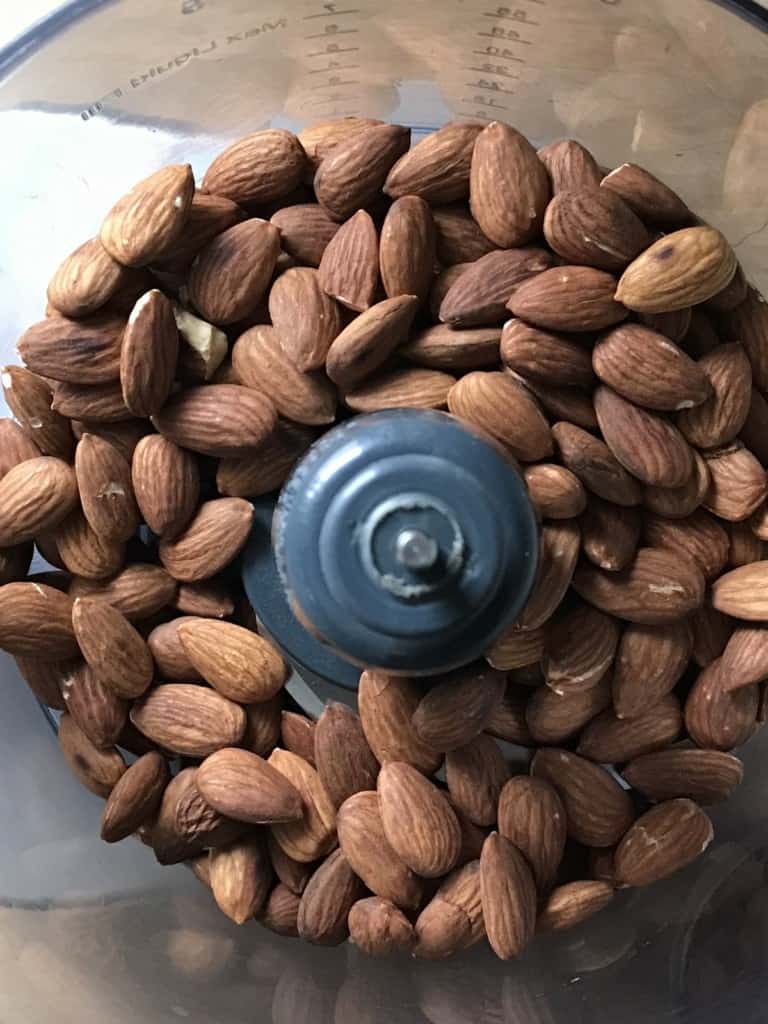 A jar filled to the top with homemade almond butter