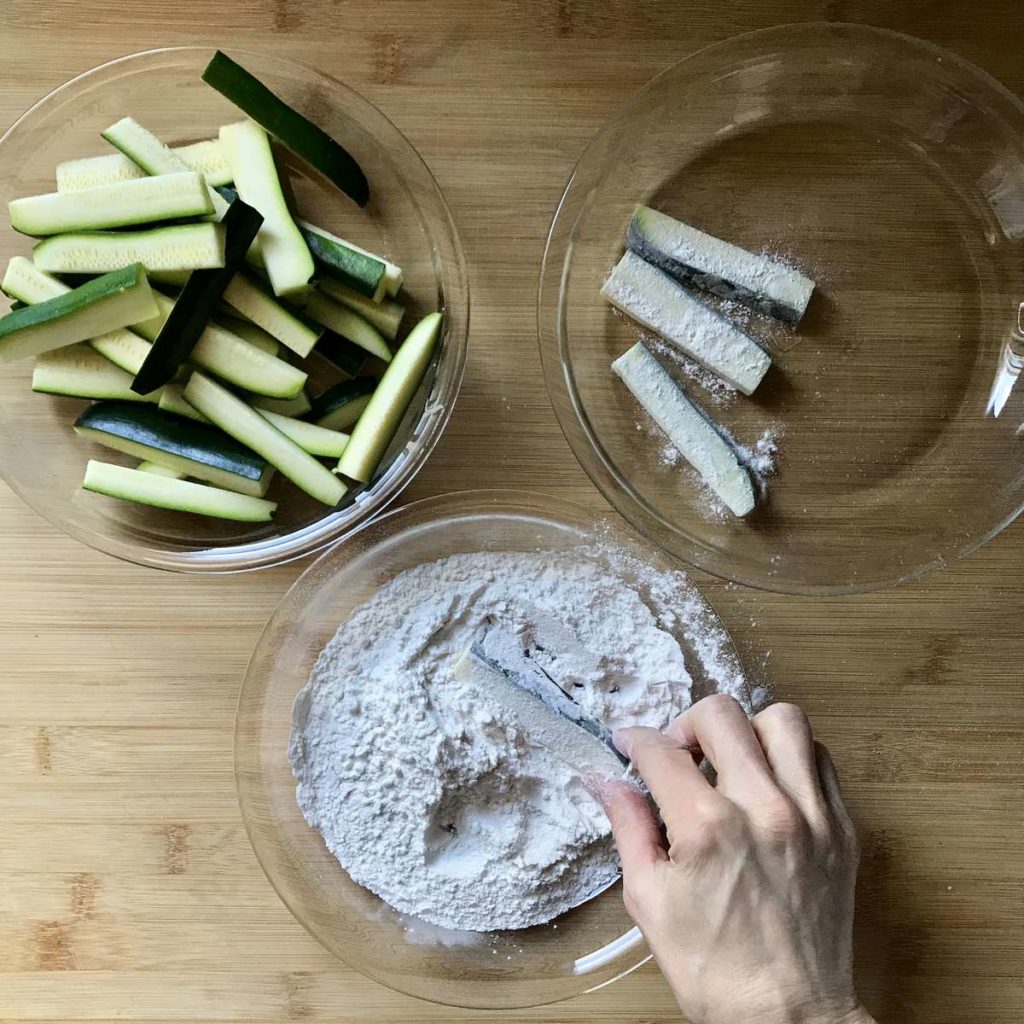 Zucchini dredged in flour.