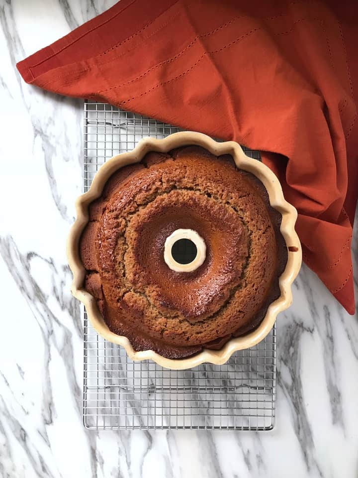 The honey cake is on a cooling rack,