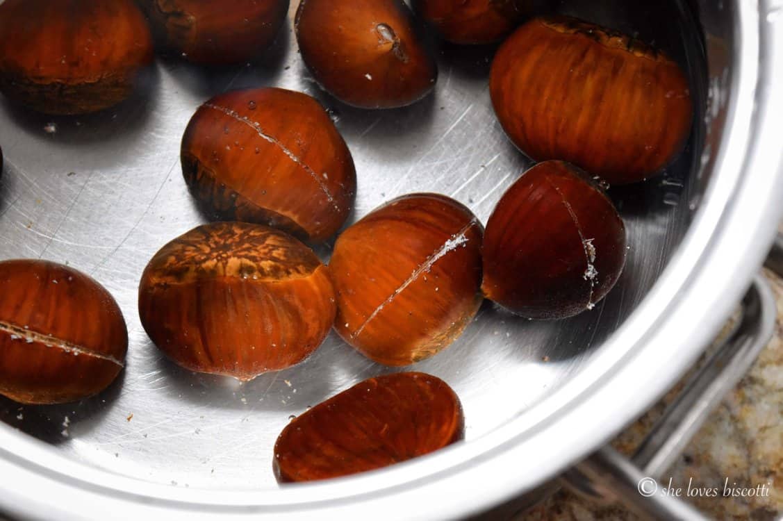 Chestnuts in a pot filled with water.