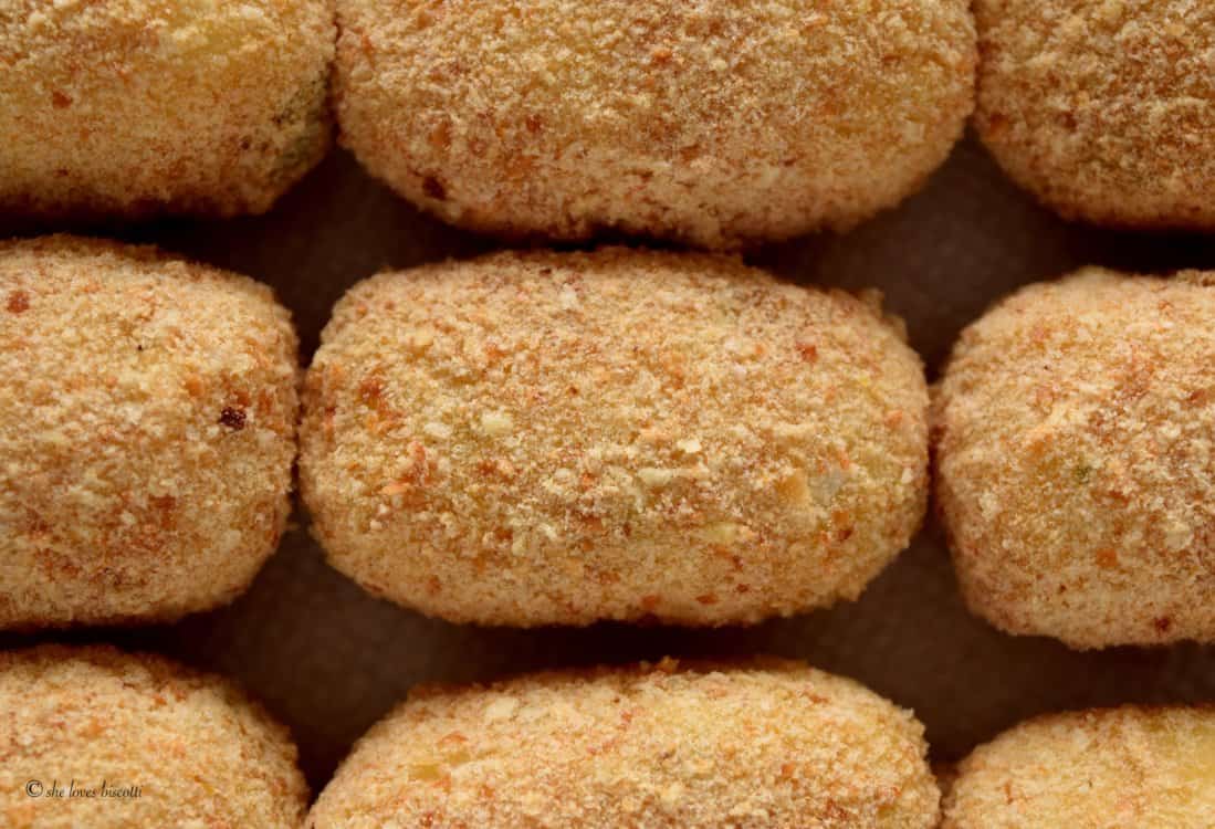 Croquettes are coated with the bread crumb mixture.