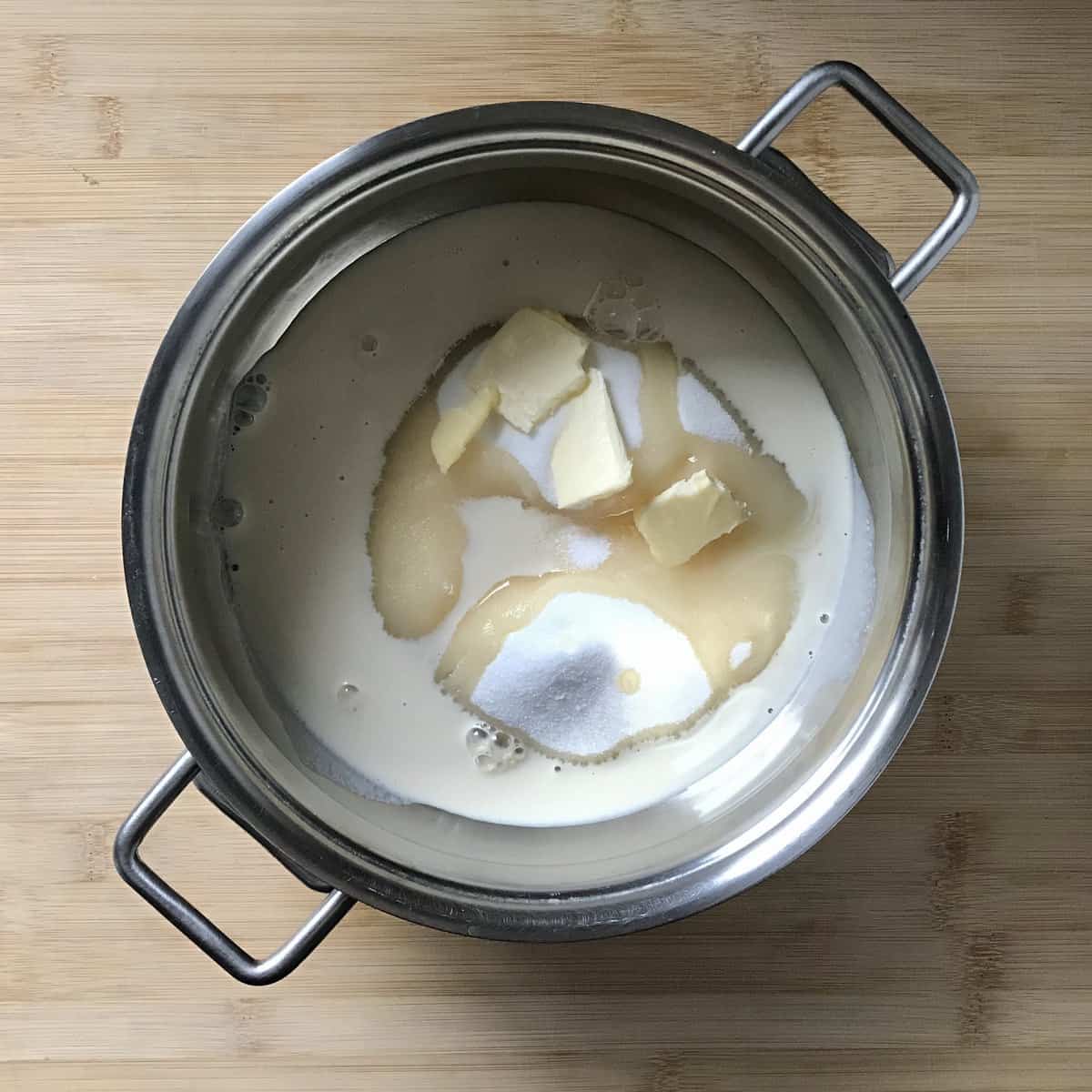Evaporated milk, sugar and butter in a saucepan.