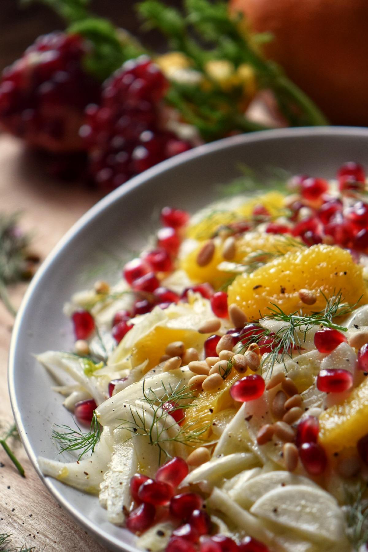 A colorful Fennel Orange Salad in a white serving platter.