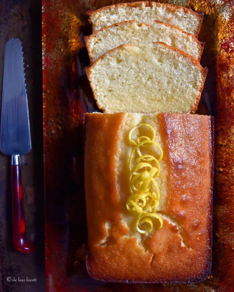 Extra Moist Lemony Lemon Loaf shown on a large serving tray.