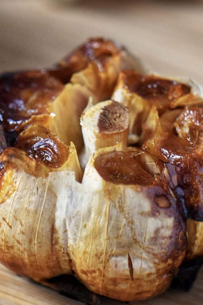 A close up shot of a roasted garlic clove.