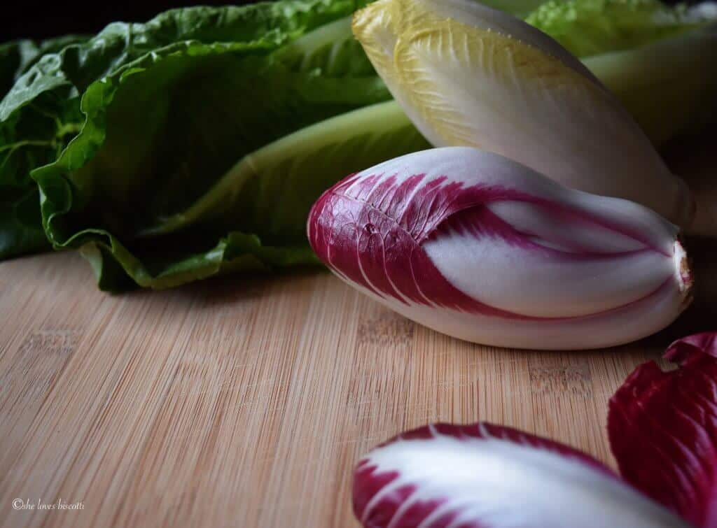 A small head of endive salad ready to be chopped up.