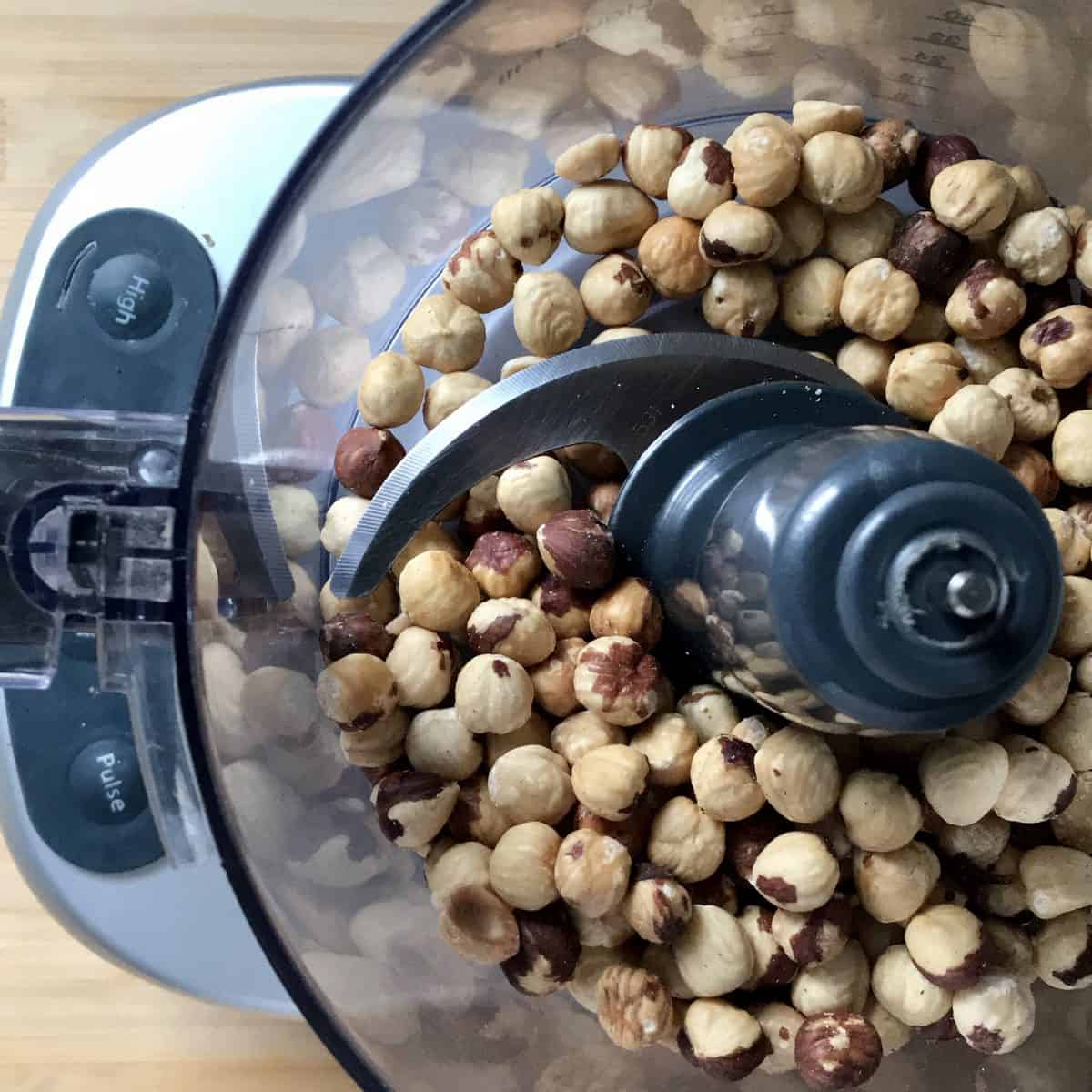Roasted hazelnuts in a food processor. 