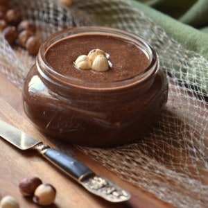 Homemade cocoa hazelnut spread in a mason jar.